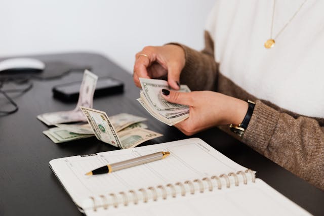 A landlord sorting their cash